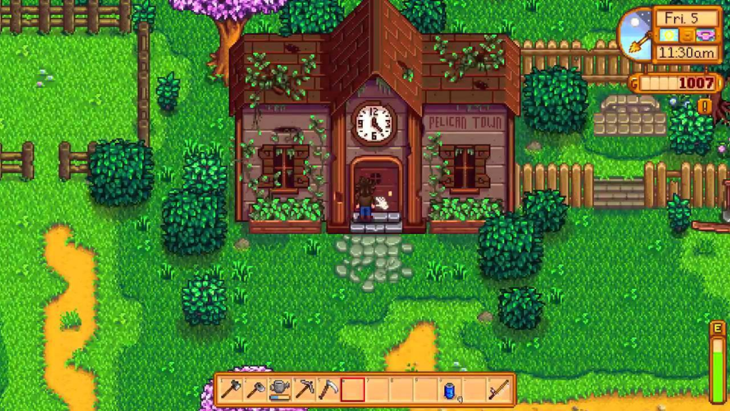 A screenshot from Stardew Valley where the player is standing next to the community center.